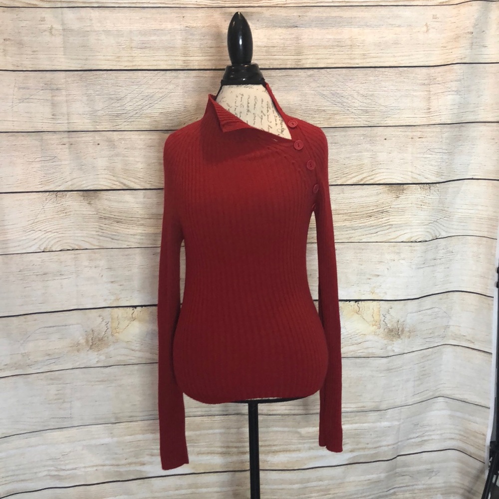 Red sweater with button detail on neck line